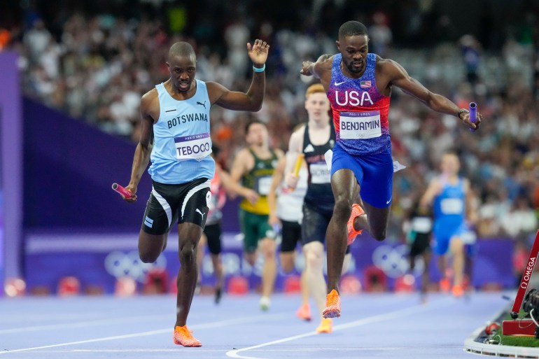 Rai Benjamin, of the United States, celebrates after winning the men's 4 x 400-meter relay final at the 2024 Summer Olympics, Saturday, Aug. 10, 2024, in Saint-Denis, France. (AP Photo/Petr David Josek)