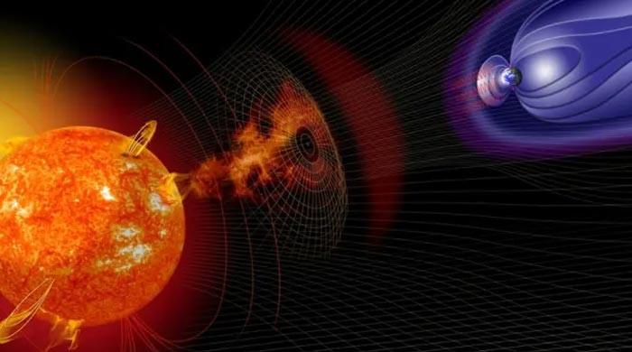 Solar storm surrounds Earth, threatening satellites and power grids