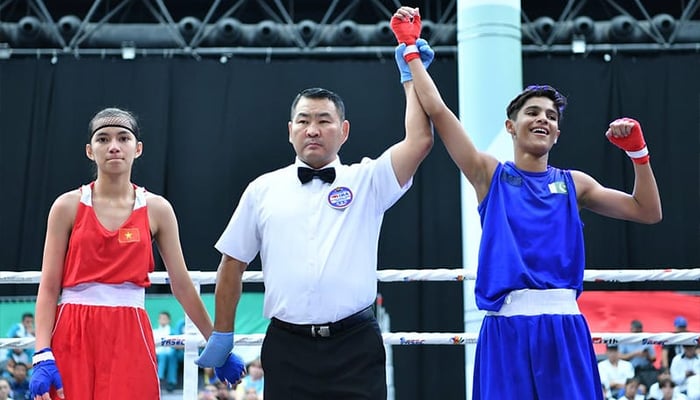 Pakistani boxer Ayesha Mumtaz celebrates after being declared winner at the Asian Junior and School Boxing Championship in Al Ain City, Abu Dhabi, on September 3, 2024. — Reporter